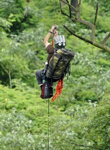 Shane McPherson climbing to an eagles nest